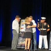 Getting a hug from the artist, Phil Taylor.
